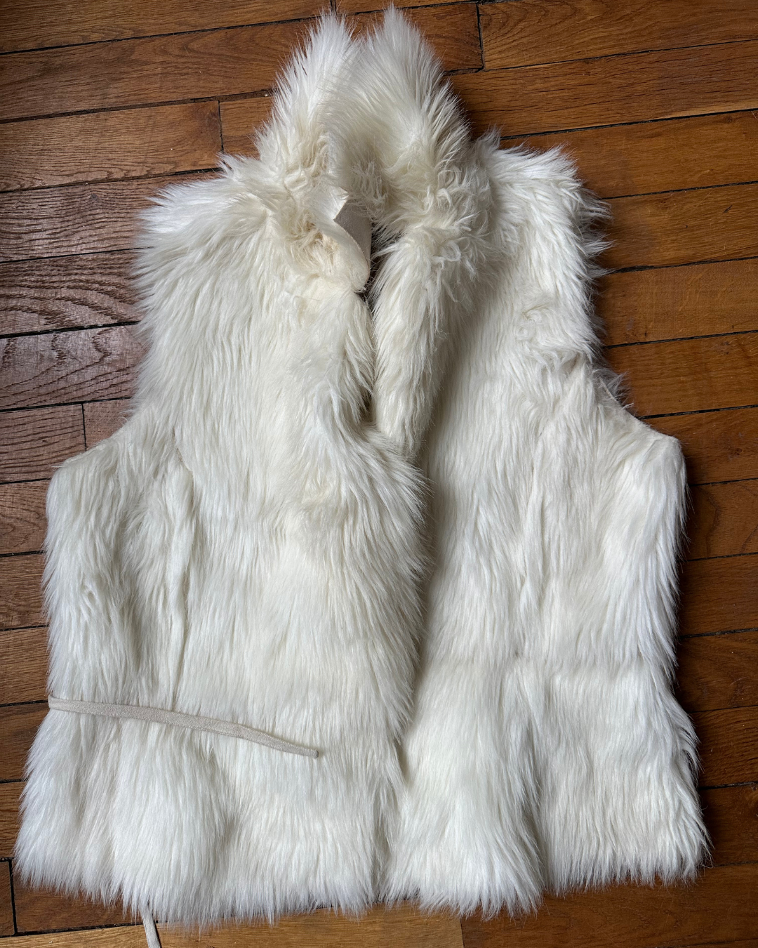 Cream sleeveless fur
