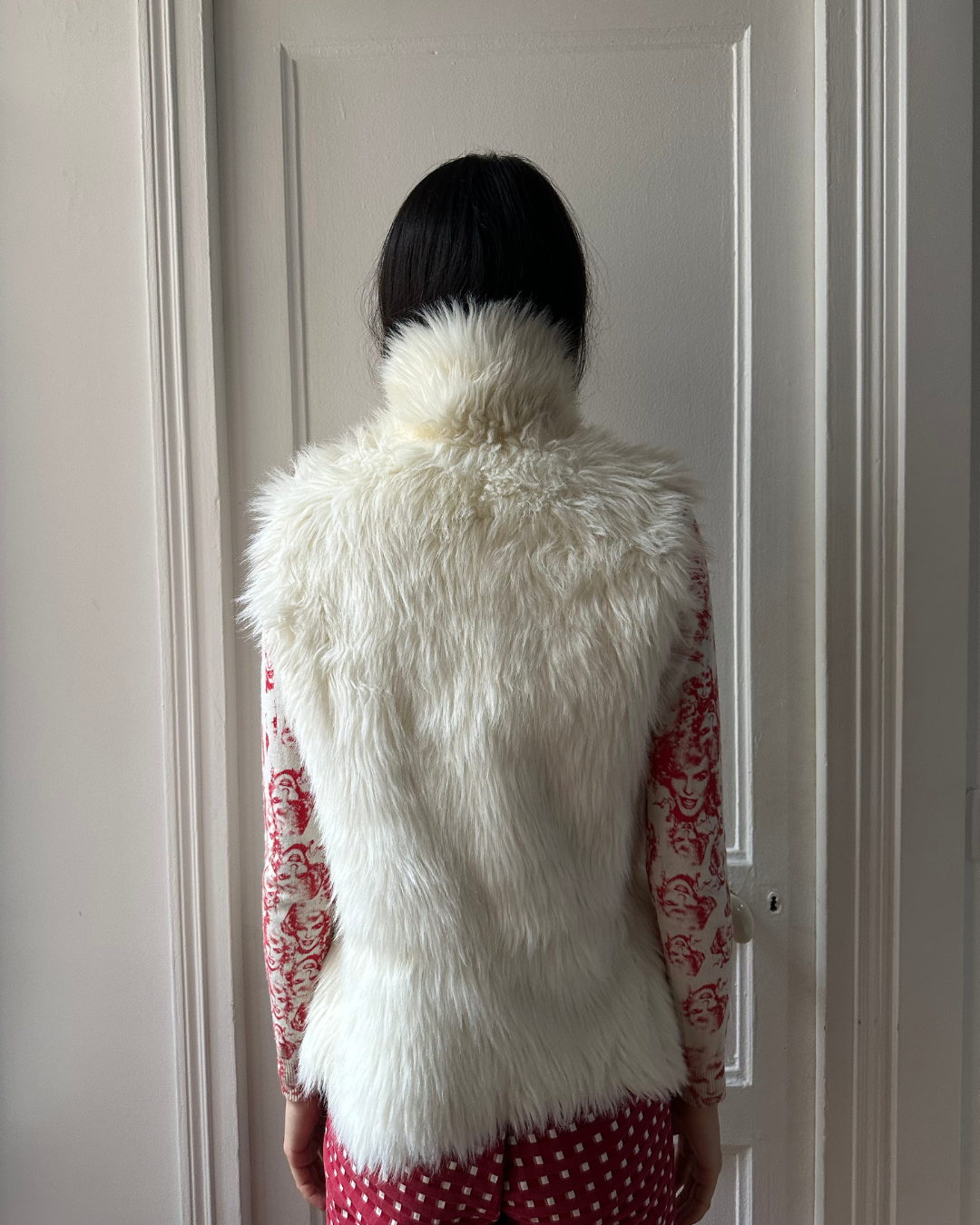 Cream sleeveless fur