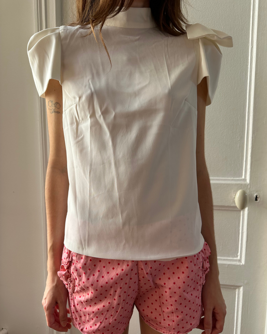 White blouse with large bow