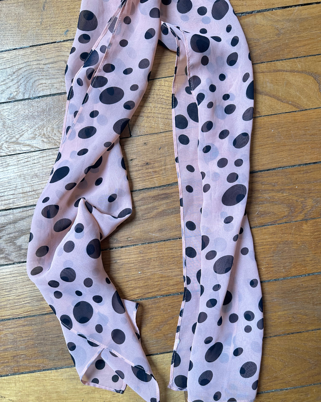 Pink scarf with black polka dots