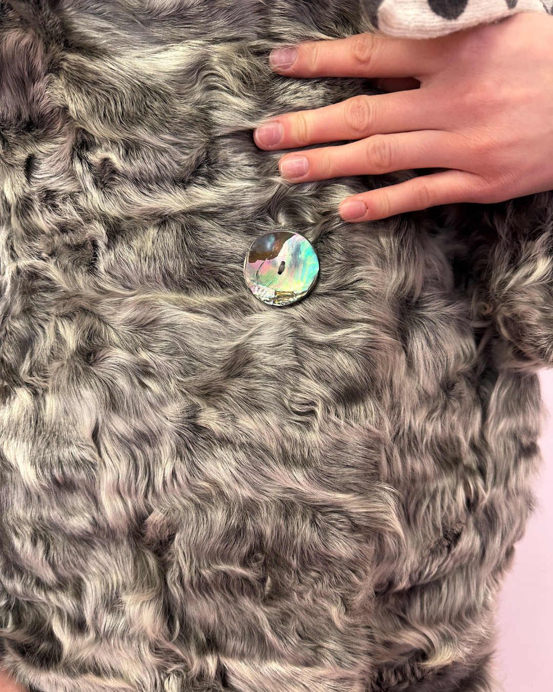 Grey fur with iridescent buttons