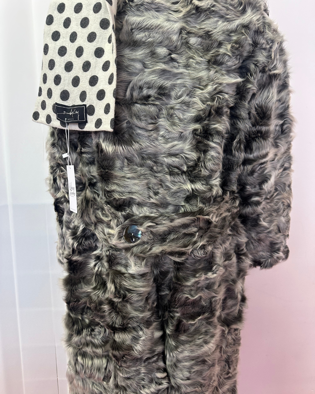 Grey fur with iridescent buttons