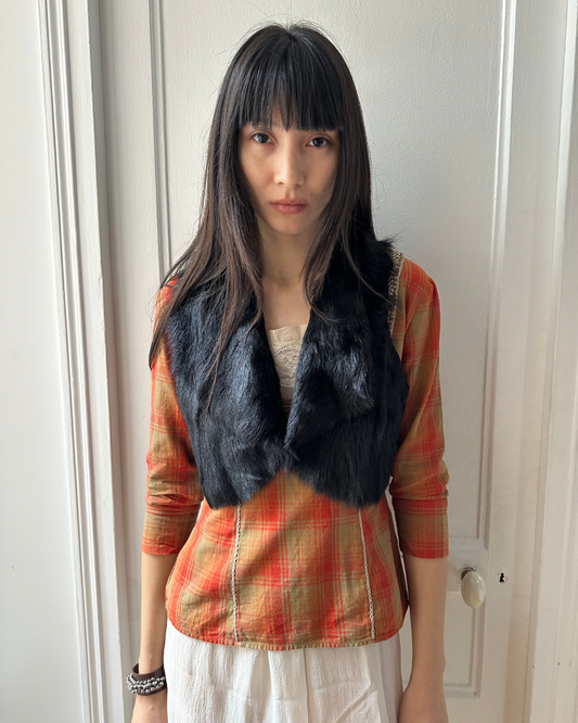 Short black fur vest