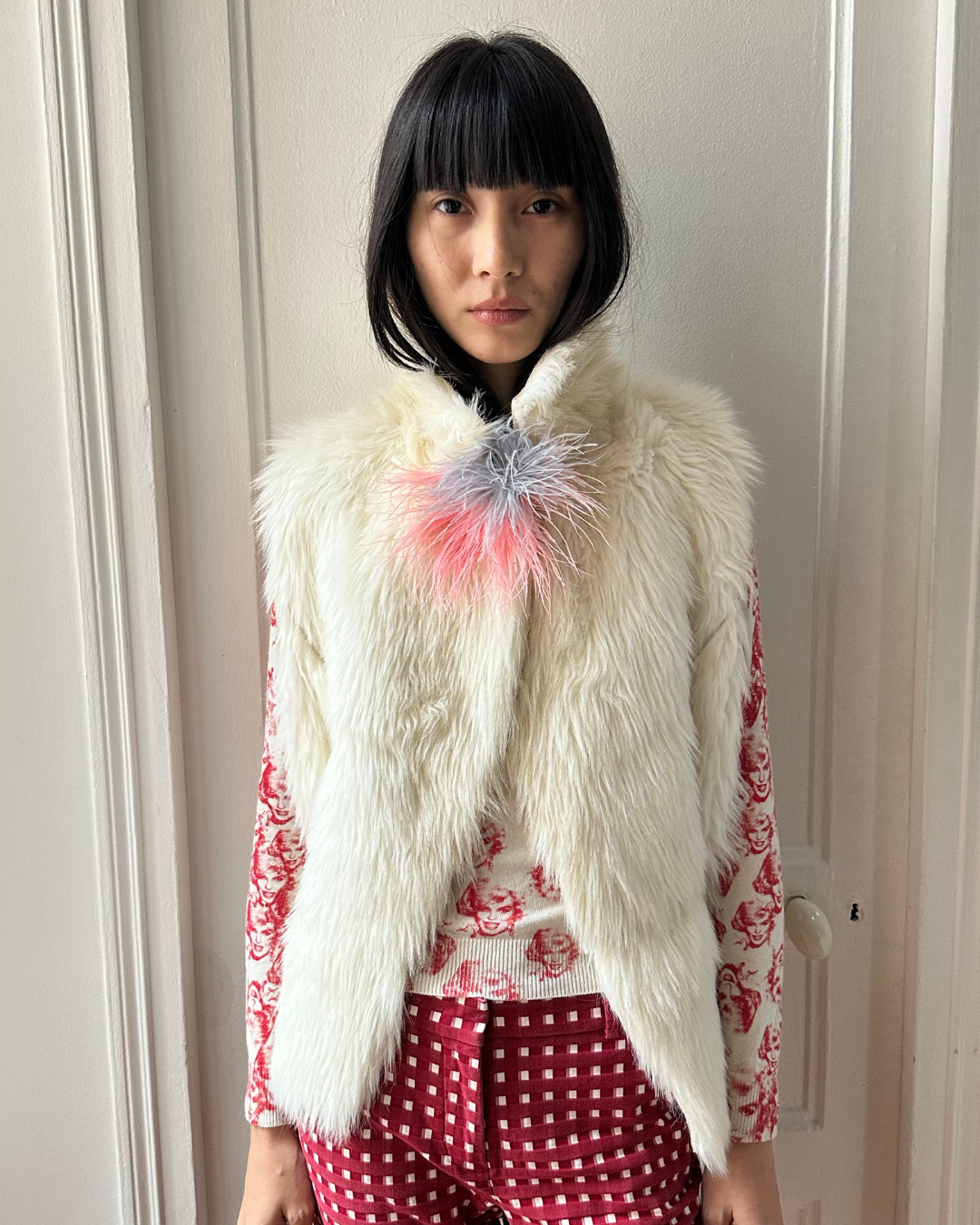 Cream sleeveless fur