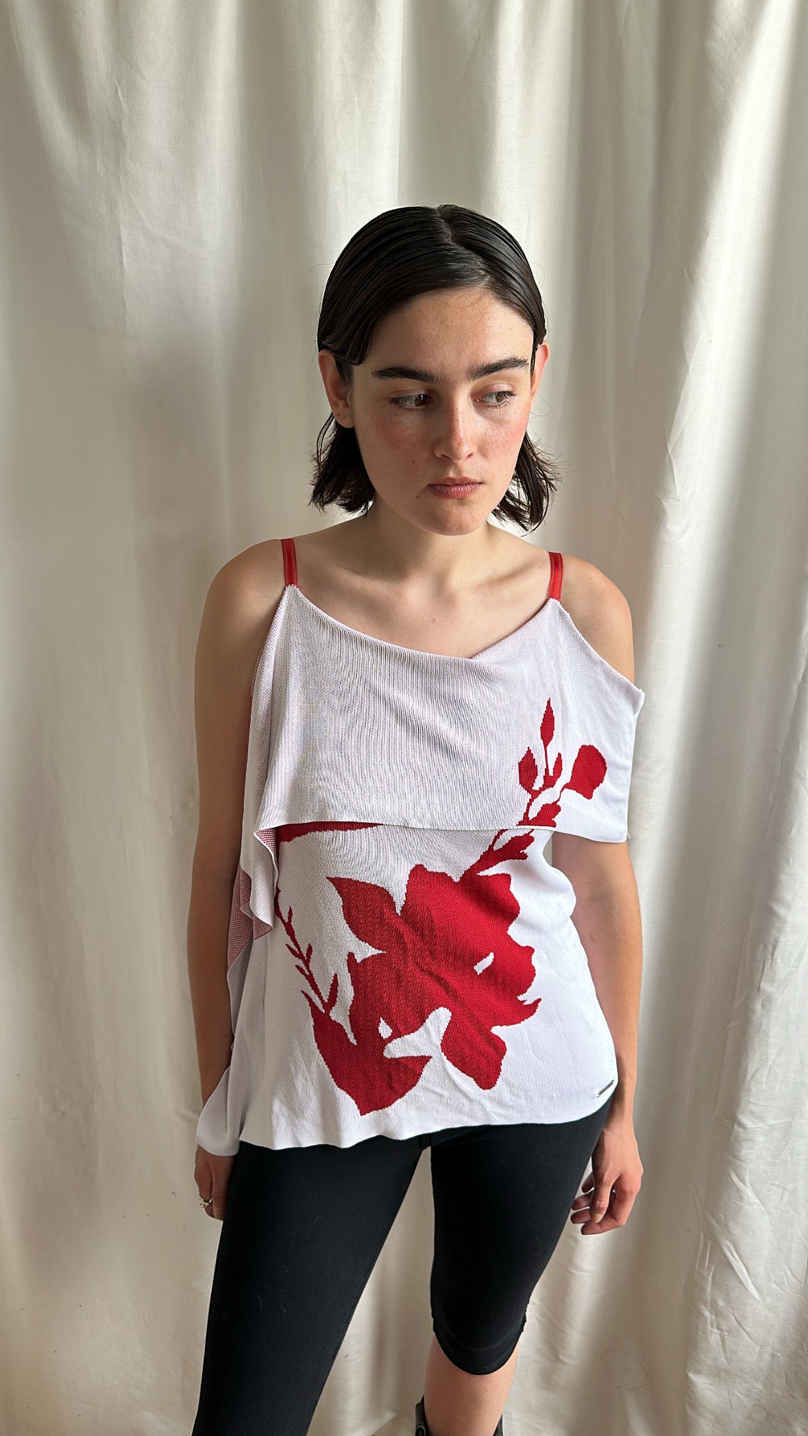 White top with red flowers