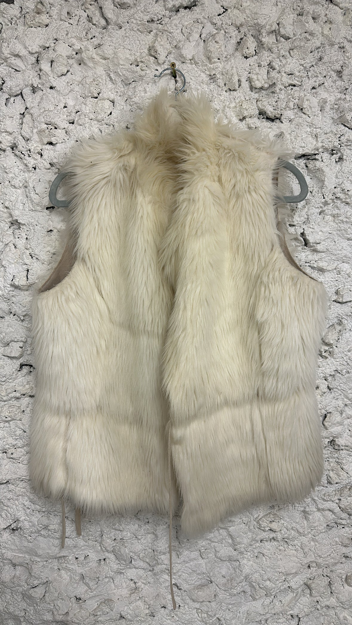 Beige sleeveless fur